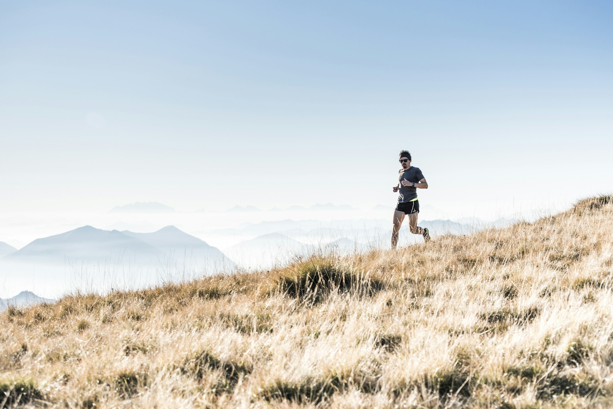 Runner on a mountain ridge at first light